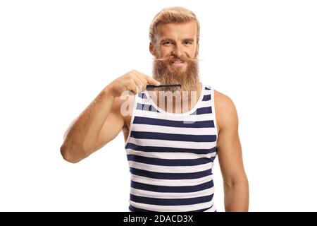 Young man combing his blond beard isolated on white background Stock Photo