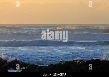 Sunset over the sea at Sandymouth in Cornwall Stock Photo