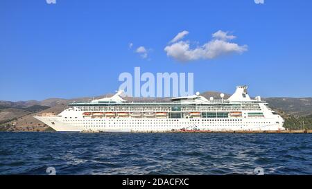 Royal Caribbean cruise ship, Rhapsody of the Seas, moored in Argostoli, on the Greek island of Kefalonia.  The cruise ship entered service in 2000. Stock Photo