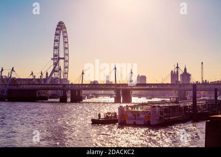 View of the London Eye, Hungerford Bridge and Golden Jubilee Bridges as well as River Thames, London, UK Stock Photo