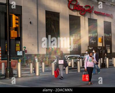 Shoppers outside the famed Century 21 department store in Downtown Manhattan in New York on Thursday, November 5, 2020. The discounter announced that it was closing down all of its 13 stores citing nonpayment from their insurance companies. (© Richard B. Levine) Stock Photo