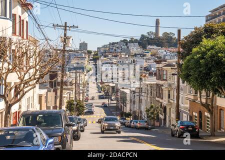 San Francisco, California, USA - MARCH 15 2019: View of the Telegraph Hill tower from Lombard Street region on a sunny day Stock Photo