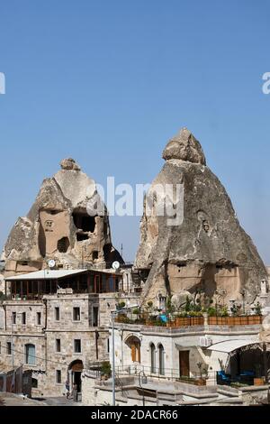 View of boutique cave hotel built around fairy chimney ruins, Cappadocia, Turkey Stock Photo