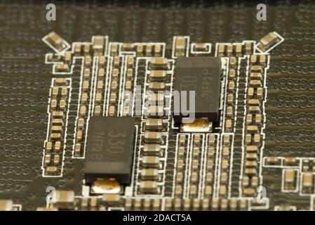 various chips on a textolite video card board for a modern desktop computer Stock Photo