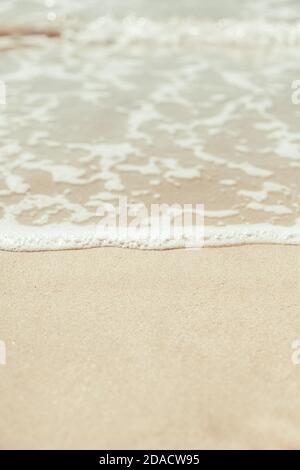 Soft blue ocean wave on sandy beach. Background. Stock Photo
