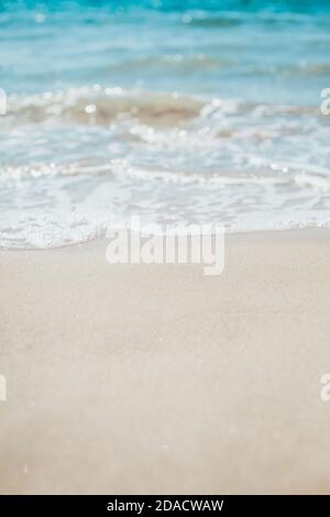 Soft blue ocean wave on sandy beach. Background. Stock Photo