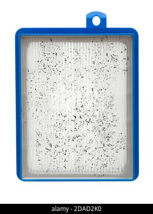 dirty spoiled used paper air filter in plastic case for home appliance vacuum cleaner, old replacement spare part isolated on white background front v Stock Photo