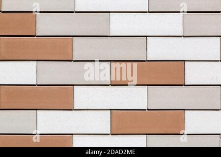 brickwork from multi colored bricks texture of the wall design of the facade and interior in loft style closeup. Stock Photo