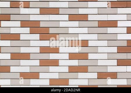 brickwork from multi colored bricks texture of the wall design of the facade and interior in loft style closeup. Stock Photo