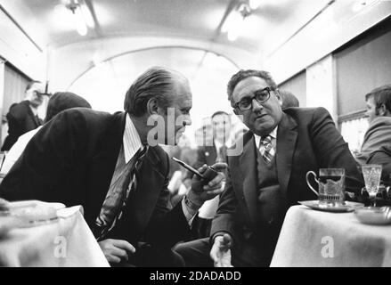 In this photo released by the White House, In the dining car on the train from Vladivostok, USSR to the airport on November 23, 1974, United States President Gerald R. Ford, left, discusses the progress on the Strategic Arms Limitation Talks (S.A.L.T.) agreement with United States Secretary of State Henry Kissinger, left. Ford and Kissinger spent two days in talks with the leaders of the Union of Soviet Socialist Republics (U.S.S.R.).Mandatory Credit: David Hume Kennerly/White House via CNP | usage worldwide Stock Photo