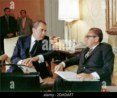 In this photo released by the White House, National Security Advisor Doctor Henry A. Kissinger, right, briefs United States President Richard M. Nixon, left, in Washington, DC on November 25, 1972.Credit: White House via CNP | usage worldwide