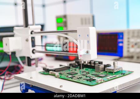 Debugging electronics device. PCB witch microcontroller in electronics laboratory Stock Photo