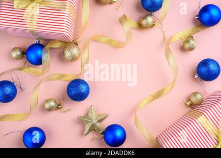 New Year's content with beautiful blue and gold balls for the Christmas tree, gold ribbon. A place for text. Flat lay Stock Photo