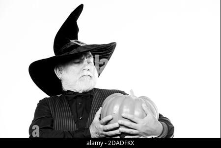 Magic concept. Experienced and wise. Halloween tradition. Cosplay outfit. Wizard costume hat Halloween party. Magician witcher old man. Senior man white beard celebrate Halloween with pumpkin. Stock Photo