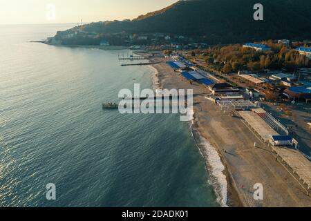 Beautiful aerial panorama of Arkhipo-Osipovka beach and promenade in Gelendzhik region, black sea coast, resort for vacations and pleasure, view from above. Stock Photo