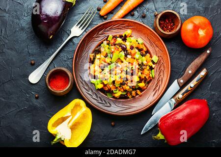 Delicious vegetable saute or stew.Slices of stewed vegetables on a plate.Healthy vegetarian food Stock Photo