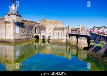 CONCARNEAU, BRITTANY, FRANCE: Entrance to the old walled city of Concarneau, located on an island next to the port. Stock Photo