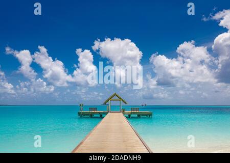 https://l450v.alamy.com/450v/2dadnh9/wooden-bridge-jetty-at-tropical-beach-in-the-maldives-at-sunny-summer-day-amazing-summer-tropical-island-beach-2dadnh9.jpg