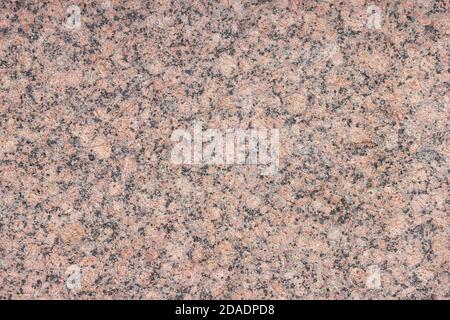 The texture of a variegated speckled polished marble slab. Stock Photo