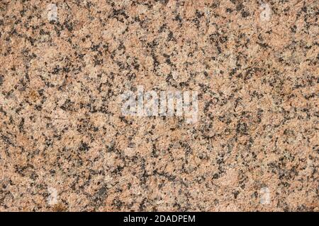 The texture of a variegated speckled polished marble slab. Stock Photo