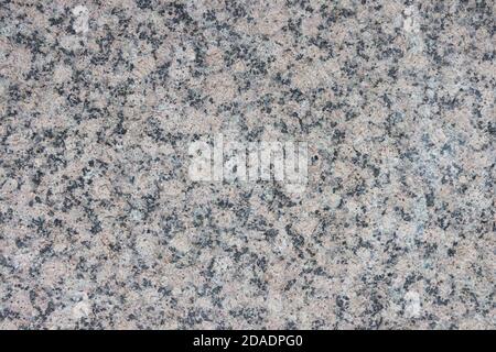 The texture of a variegated speckled polished marble slab. Stock Photo