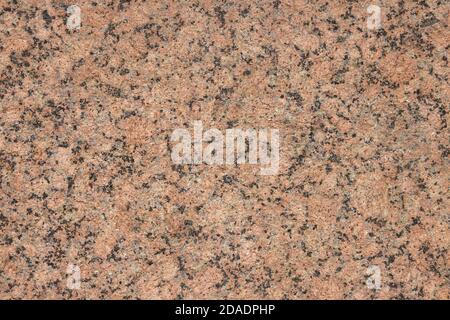 The texture of a variegated speckled polished marble slab. Stock Photo