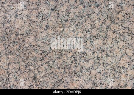 The texture of a variegated speckled polished marble slab. Stock Photo