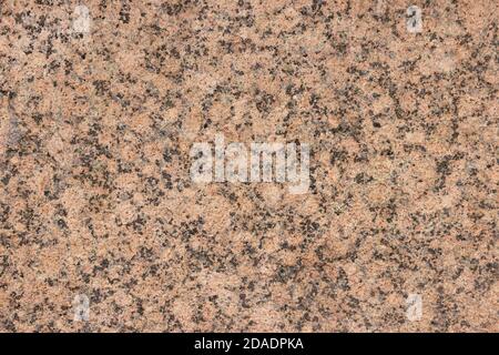 The texture of a variegated speckled polished marble slab. Stock Photo