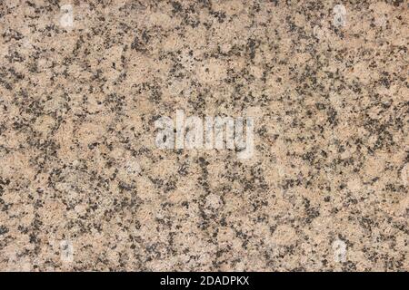 The texture of a variegated speckled polished marble slab. Stock Photo