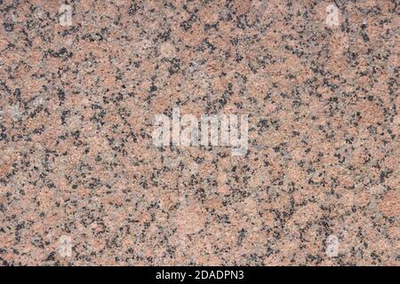 The texture of a variegated speckled polished marble slab. Stock Photo
