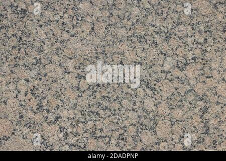 The texture of a variegated speckled polished marble slab. Stock Photo