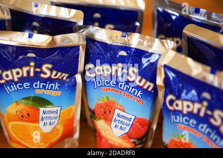 Capri-Sun orange and summer berries juice pouches Stock Photo