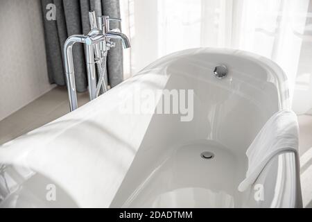 White bathroom in natural light, sunny bathroom section. Luxury hotel resort suite. Stock Photo