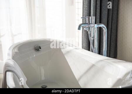 White bathroom in natural light, sunny bathroom section. Luxury hotel resort suite. Stock Photo