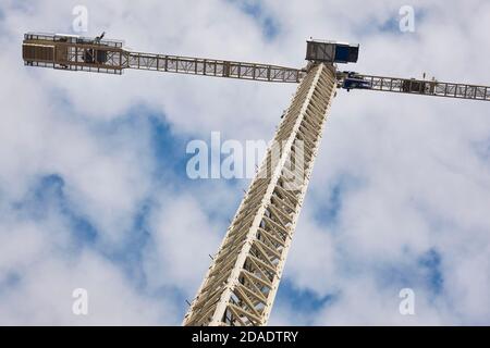 Telescopic crane under a white sky. Construction engineering industry Stock Photo