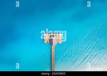 Aerial top view tropical island white sand beach with blue lagoon sea in Maldives island, Beautiful tropical resort hotel. Amazing aerial landscape Stock Photo