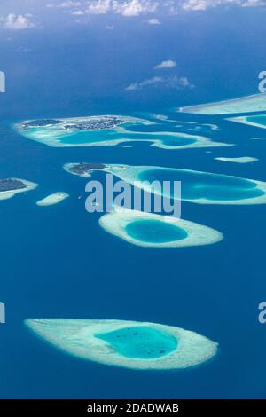 Aerial view on tropical islands. Aerial photo of beautiful paradise Maldives tropical beach on island. Summer and holiday and travel vacation Stock Photo
