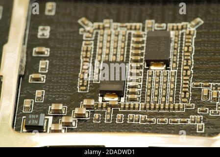 various chips on a textolite video card board for a modern desktop computer Stock Photo