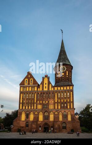 Cathedral Dome in Kaliningrad, Russia at sunset against a blue sky with clouds, vertical view Stock Photo
