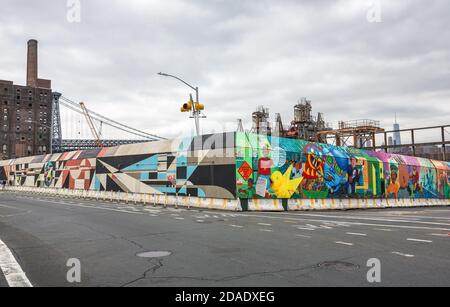 NEW YORK, USA - May 05, 2016: Industrial object decorated with graffiti on crossroads of Street and Kent Ave in Brooklyn on an overcast day Stock Photo