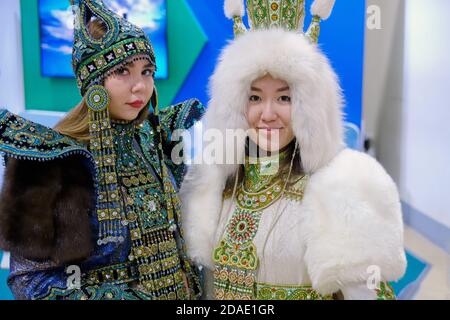 Girls in traditional costumes of the far East. Women in ethnic folk costumes - Days of the Far East, Moscow, Russia, 12 13 2019 Stock Photo