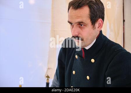 Moscow  Russia 06 07 2019: Surgeon in a field military hospital, retro style. Reconstruction of mobile medicine in the old days. Stock Photo