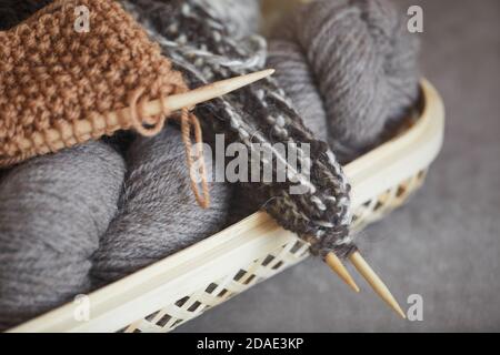 Close-up of balls of yarn and needles for knitting the warm scarf Stock Photo