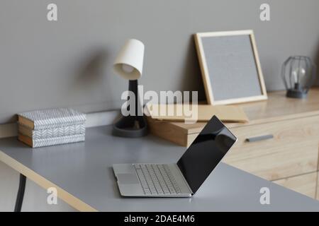 Image of empty modern workplace with laptop on it at office Stock Photo