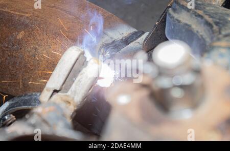 Welder Welding Bottom Car Chassis by Electric Welding Torch on Top View Stock Photo