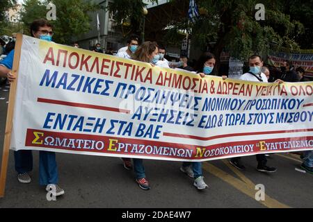 Athens, Greece. 12th Nov, 2020. Healthcare workers hold placards and banners protesting over the government's inefficiency to deal with the pandemic. Healthcare workers at Evaggelismos hospital took part in a nationwide demonstration outside hospitals, condemning healthcare underfunding and demanding PPE as well as hospital staffing. Credit: Nikolas Georgiou/ZUMA Wire/Alamy Live News Stock Photo