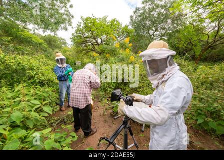 CHARAGUA, BOLIVIA - Jul 30, 2013: Charagua, Santa Cruz / Bolivia - July 29 2013: A Photographer with a Complete White Uniform for the Protection of th Stock Photo