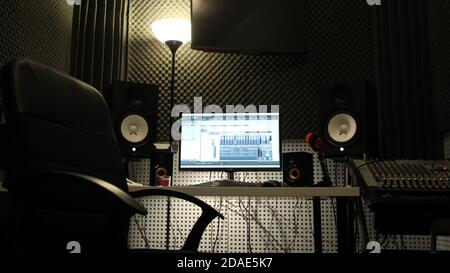 Workplace in a real recording Studio. Professional work with sound on the Director's console. The process of recording music and vocals Stock Photo