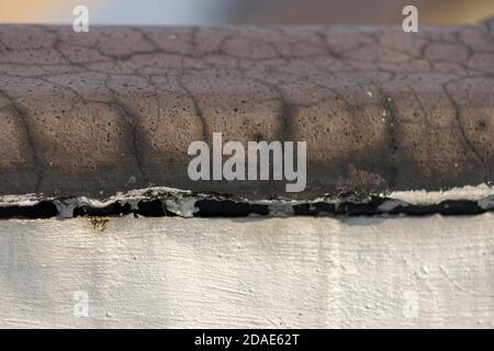A closeup look at aged terra cotta tiles on a Bronx rooftop Stock Photo