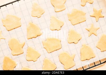 Close-up of raw christmas gingerbread cookies on wooden background. Stock Photo